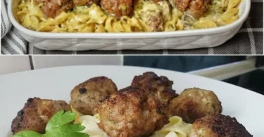 Fleischbällchen serviert mit Tagliatelle und einer cremigen Pilzsoße auf einem Teller