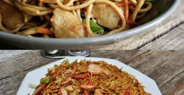 Geschmackvolle gebratene Nudeln mit Hähnchen, frischem Gemüse und Ei