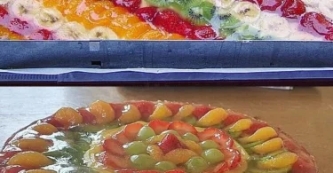 Leckerer Früchteboden mit Pudding und glanzvoller Fruchtdekorierung