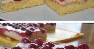 Köstliche Kirschtorte mit Sauerrahm auf einem Teller, dekoriert mit Kirschen.