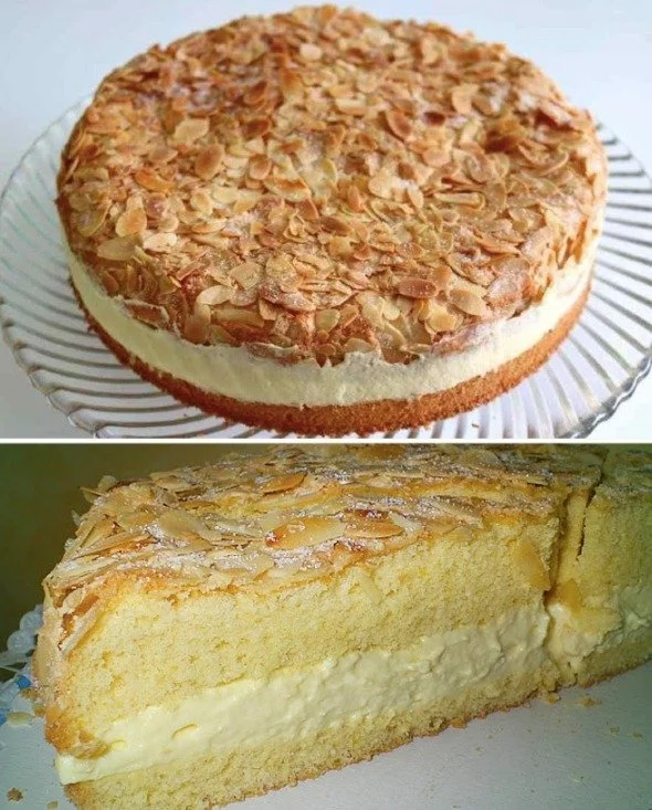 Leckere Mandeltorte mit Mandeln und Sahne dekoriert