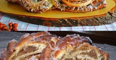 Leckerer Nusszopf auf einem Holzbrett mit Nüssen und Puderzucker