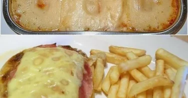 Schweinekoteletts mit Ananas und Käse auf einem Teller angerichtet