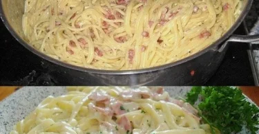 Ein Teller Spaghetti Carbonara mit Parmesan und frischem Pfeffer
