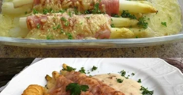 Spargel im Schinkenmantel mit Sahnesauce auf einem Teller angerichtet.