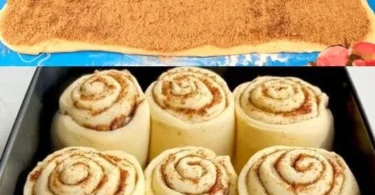 Frisch gebackene Zimtschnecken auf einem Teller, dekoriert mit Zuckerguss