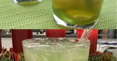 Ahoj Woodruff Cocktail in einem Glas mit frischer Holzkräuter-Dekoration