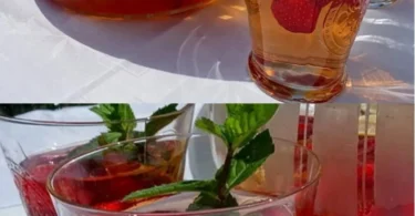 Alkoholfreier Erdbeer-Punsch in einem Glas mit frischen Erdbeeren