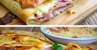 Gefüllter Blätterteigstrudel mit Schinken und Käse, serviert auf einem Teller.