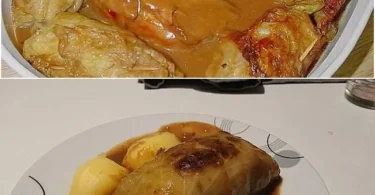 Kohlroulade mit Fleischfüllung auf einem weißen Teller serviert