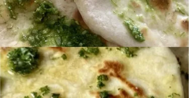 Frisch gebackenes Naanbrot auf einem Teller serviert, ideal für indische Gerichte.