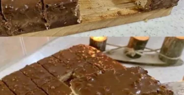 Nusskuchen mit Schokoladenglasur auf einem Teller serviert