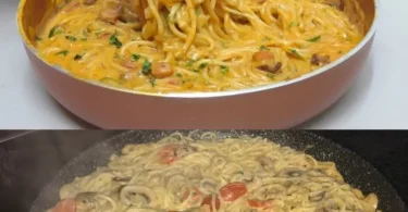 Pasta mit Pilzen und Parmesan auf einem Teller serviert