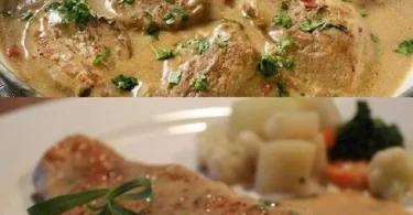 Schnitzel in Sahnesauce auf einem Teller serviert mit Beilagen