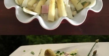 Spargelsalat mit Schinken und Eiern auf einem Teller serviert