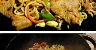 Leckeres Wok-Gericht mit Hähnchen und Eiernudeln in einer Pfanne