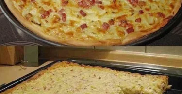Leckeres Stück Zwiebelkuchen auf einem Teller mit frischen Zutaten