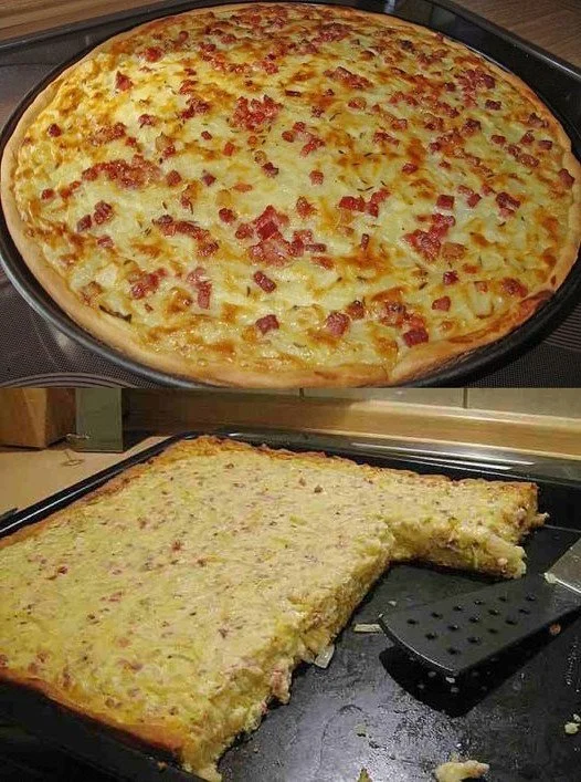 Leckeres Stück Zwiebelkuchen auf einem Teller mit frischen Zutaten